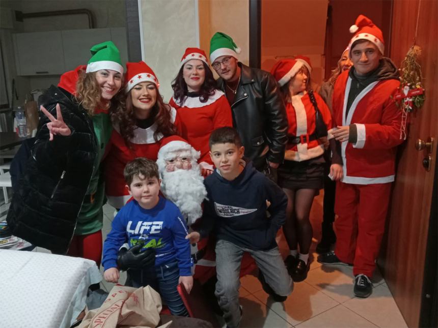 Quattro Torri di "Regali di Natale a domicilio per i bambini"