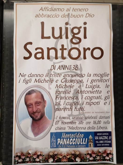 Il manifesto con la foto di Luigi Santoro